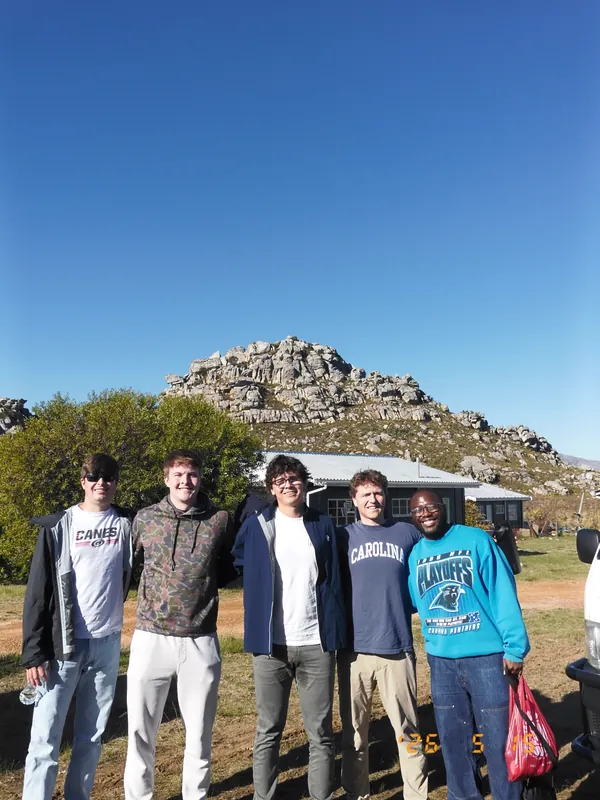 Friends standing together in the mountains