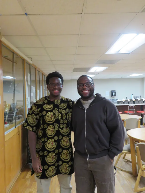 Etornam standing with a mentor