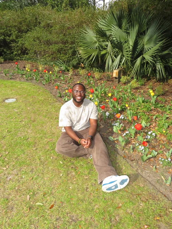 Etornam sitting in a garden